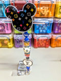 LV inspired badge reel