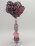Triple heart badge reel
