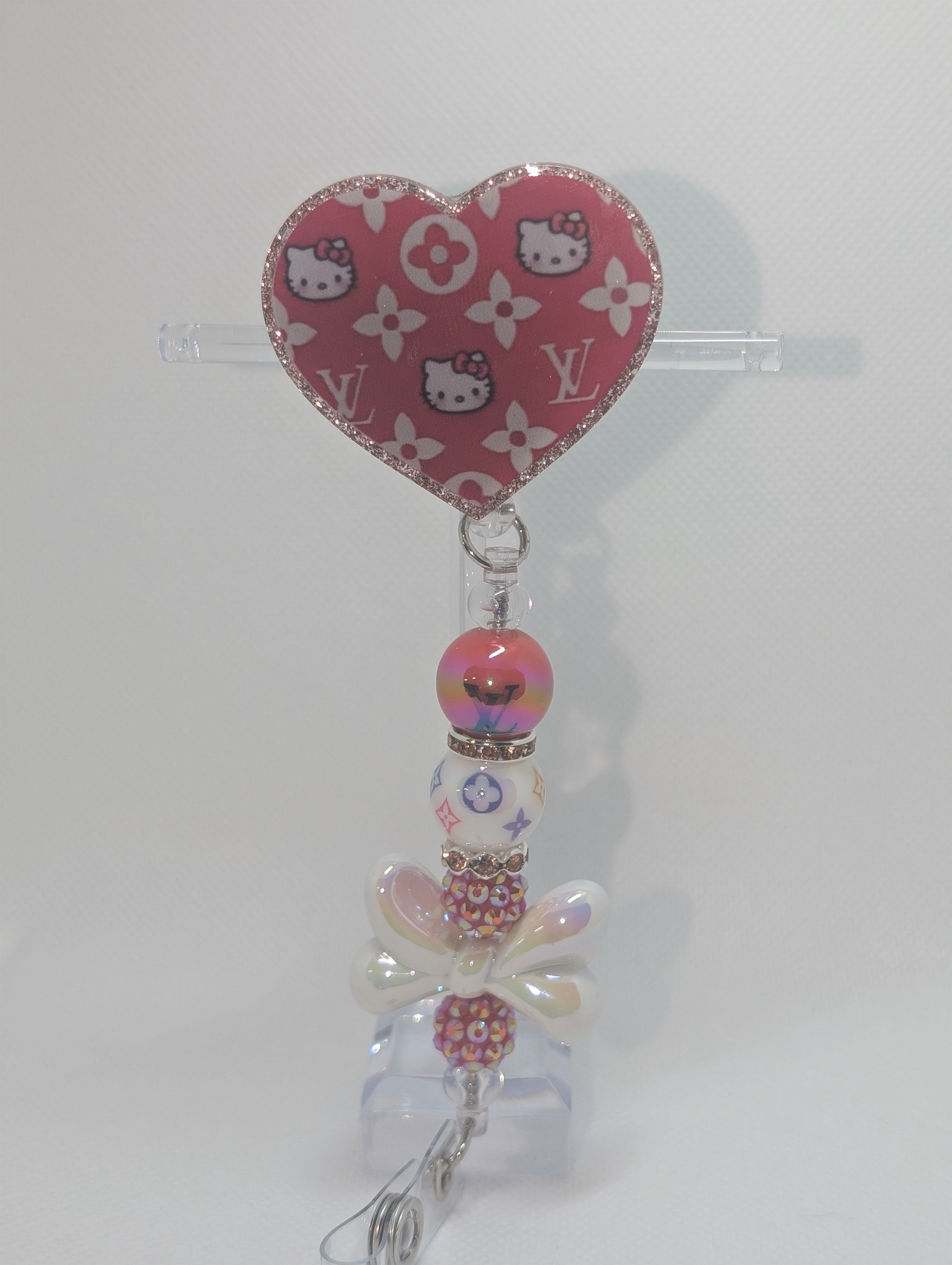 LV x HK badge reel